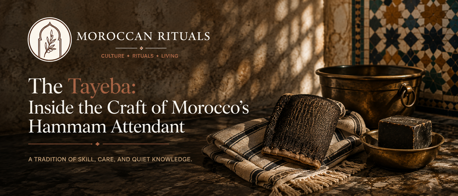 A neighbourhood hammam attendant seated on a low tiled bench in the wet room, a woven kessa mitt tucked into the fold of her sarong and a plastic bucket at her feet.